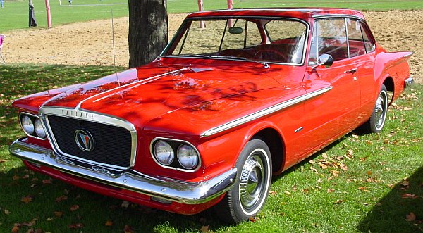 A 1963 Chrysler Imperial Convertible and a Plymouth Valiant